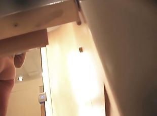 Asian girl showing her tits in the changing room